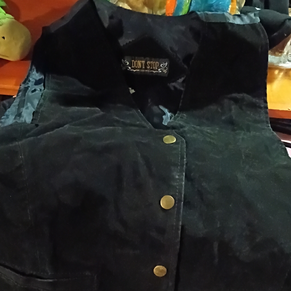Stylish Black Vest with Brass Accents